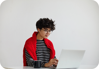 Person working on laptop at table